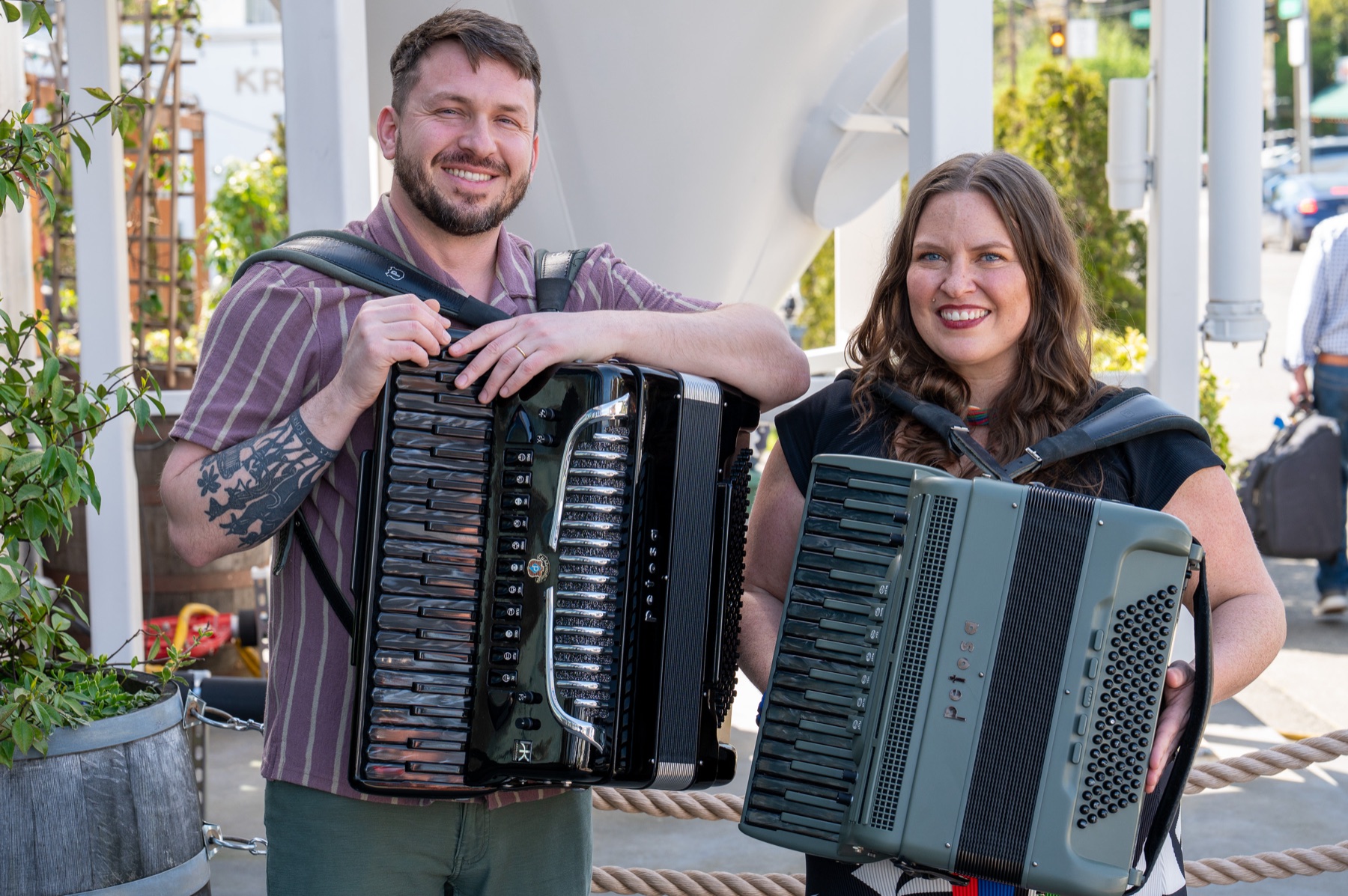 Gabe Hall-Rodrigues and Jamie Maschler holding their accordions